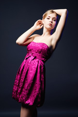 Beautiful young woman wearing pink dress
