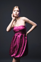Beautiful young woman wearing pink dress