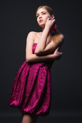 Beautiful young woman wearing pink dress