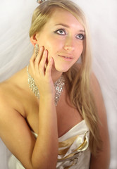 beautiful young blond girl in a wedding dress