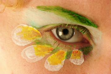 Naklejka premium An eye of beautiful woman with creative makeup