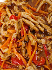 Chinese fried pork meat with pepper and carrot