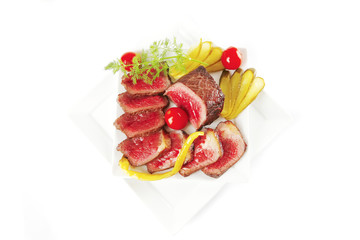 meat chunk and slices on plates