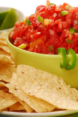 Tortilla chips with salsa and lime