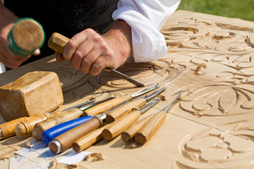 Traditional craftsman carving wood