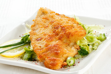 Fried fish fillet with vegetables