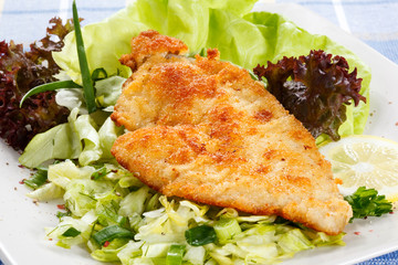 Fried fish fillet with vegetables