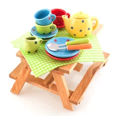 Photo sur Plexiglas Pique-nique Wooden picnic table with crockery