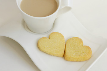 Cookies in the form of heart with a coffee cup