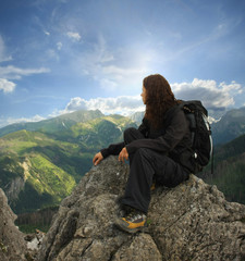 Woman on the top of a high mountain - 23157809
