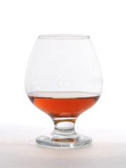 glass of brandy isolated on white.