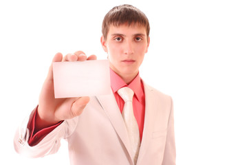 Young man holding a card isolated on white