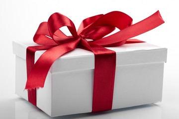 Gift decorated with a tape and a bow