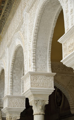 Fototapeta na wymiar Decorated arches in the main patio of Casa de Pilatos in Seville