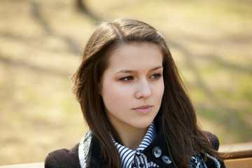 Young girl sitting on bench