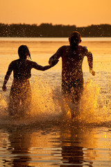 Couple running in lake