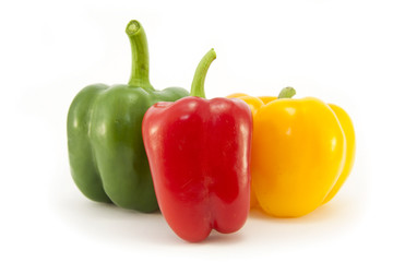 Red, Green and Yellow peppers isolated on white