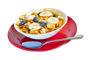 Bowl of corn flakes with blueberries and bananas
