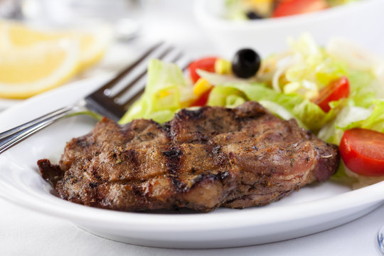 Grilled steak with vegetable salad