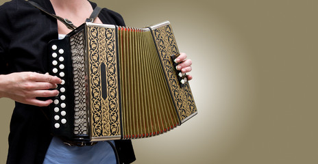 Woman playing traditional accordion