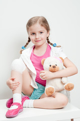 Little girl with bandage on knee