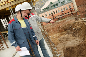 Engineers builders at construction site