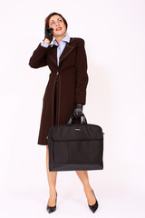 Confident businesswoman with briefcase