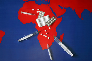 Map with tabletes, syringes and needles © smart.art