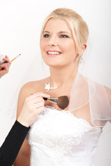 Bridal make-up is being applyed