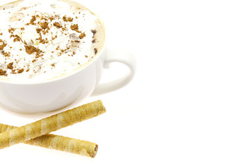 cappuccino with wafer rolls isolated on white