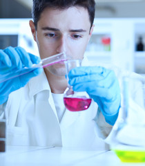 young male researcher carrying out scientific research in a lab
