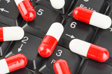 Pills on computer keyboard