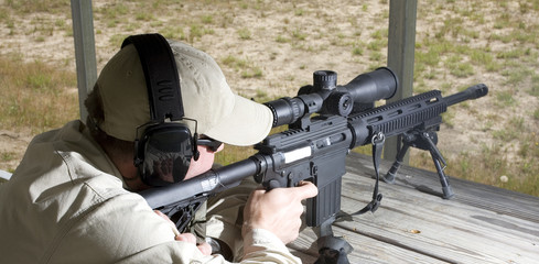 shooting practice from a wood bench at an outdoor range