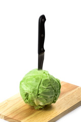 green cabbage with knife