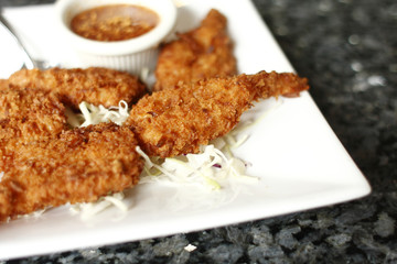 Coconut batter prawns on the table.
