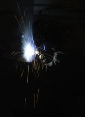 Welder fabricating steel