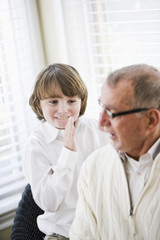 Boy smiling with grandfather