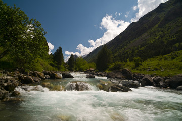 Fototapeta na wymiar fast river in mountains