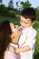 mother playing with her son outdoor
