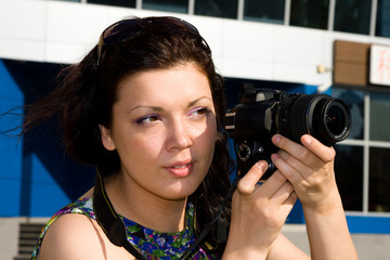 Female photographer takes a photo