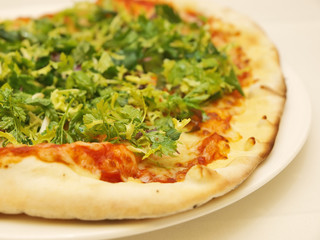 pizza with fresh herb and rucola