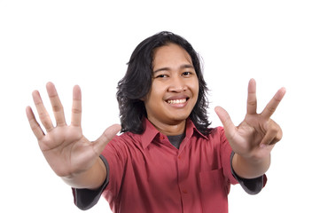 Long hair man give number eight by hand gesture