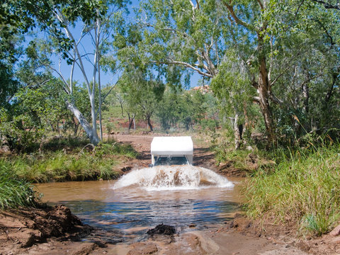 Campervan crossing river in Australia