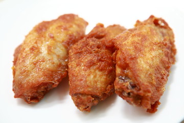 Plate of crispy, delicious fried chicken .