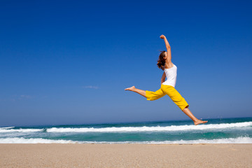 Fototapeta premium Young woman jumping