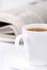 cup of coffee and newspapers