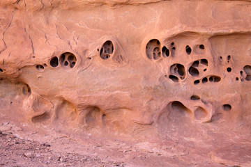Strange Holes in Red Rock Sandstone