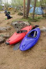 Two canoes near forest camp