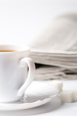 cup of coffee and newspapers