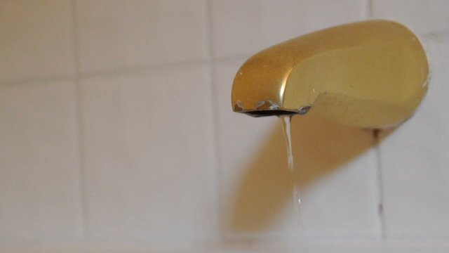Water Dripping From Bathtub Faucet